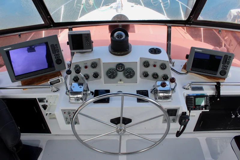 Rc Venture Yacht Photos Pics Cockpit of 1989 Ocean Alexander 44 yacht with navigation instruments and steering wheel.