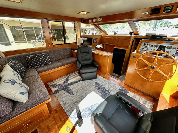 Rc Venture Yacht Photos Pics Luxurious interior of 1989 Ocean Alexander 44 yacht with plush seating and wooden helm.