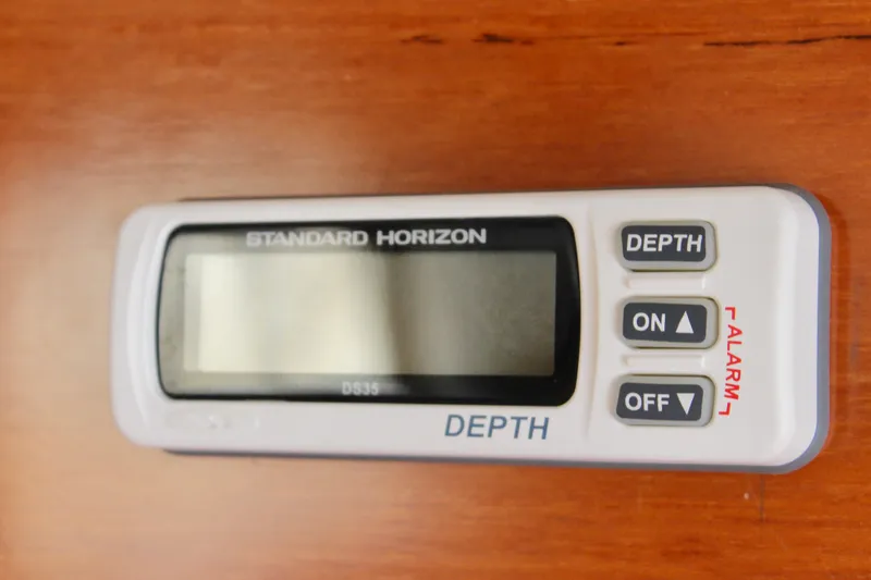 Rc Venture Yacht Photos Pics Standard Horizon depth gauge on 1989 Ocean Alexander 44 yacht, wooden background.