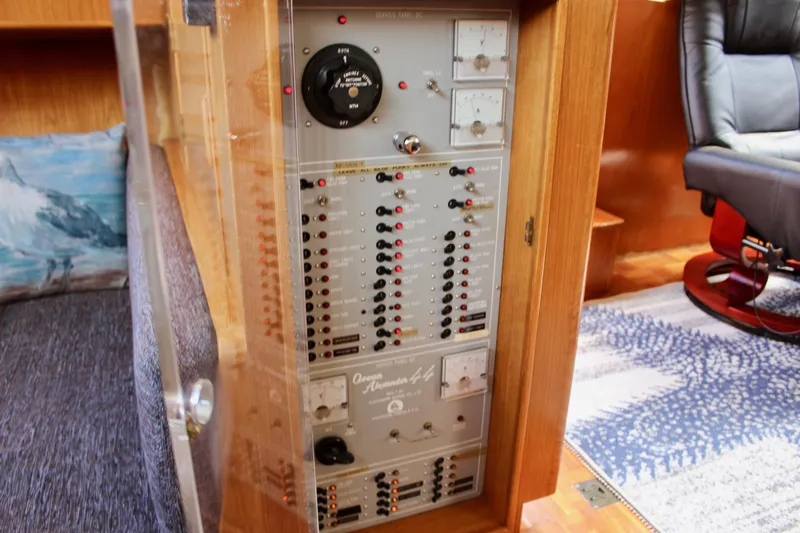 Rc Venture Yacht Photos Pics Electrical panel inside 1989 Ocean Alexander 44 yacht, featuring various switches and controls.