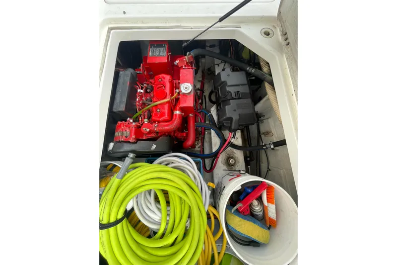  Yacht Photos Pics Engine compartment of 1999 Bayliner 3988 Motoryacht with hoses and cleaning supplies.