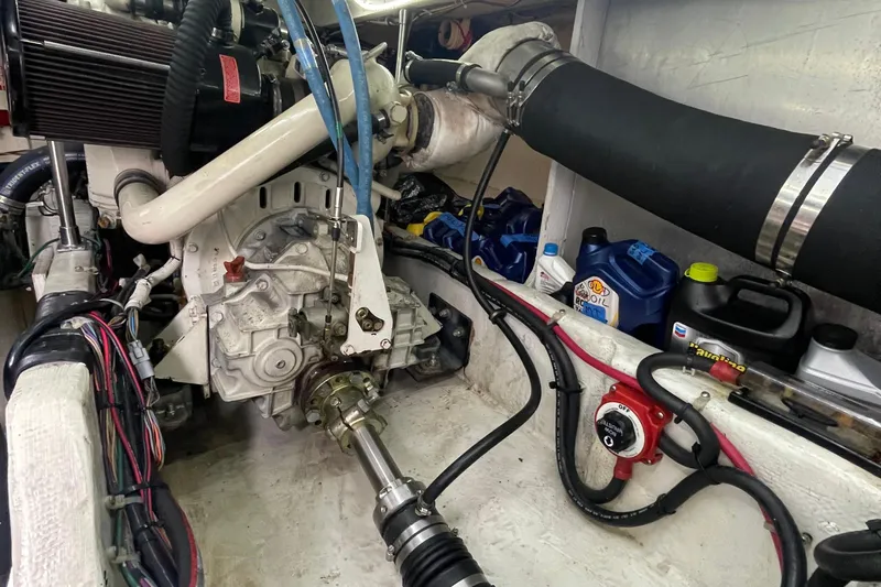  Yacht Photos Pics Engine room of 1999 Bayliner 3988 Motoryacht with visible components and oil containers.