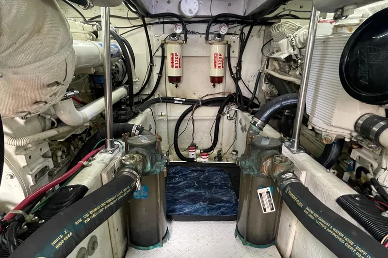  Yacht Photos Pics Engine room of 1999 Bayliner 3988 Motoryacht with visible components and hoses.