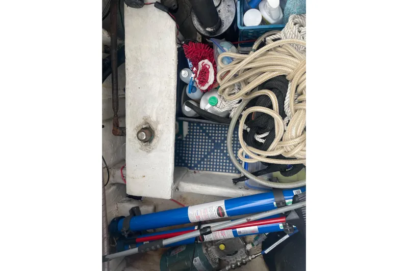  Yacht Photos Pics 1999 Bayliner 3988 Motoryacht storage area with ropes, tools, and maintenance supplies.