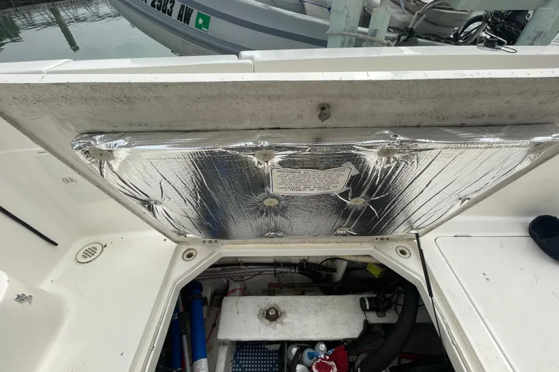  Yacht Photos Pics Open engine compartment of a 1999 Bayliner 3988 Motoryacht, showing insulation and mechanical components.