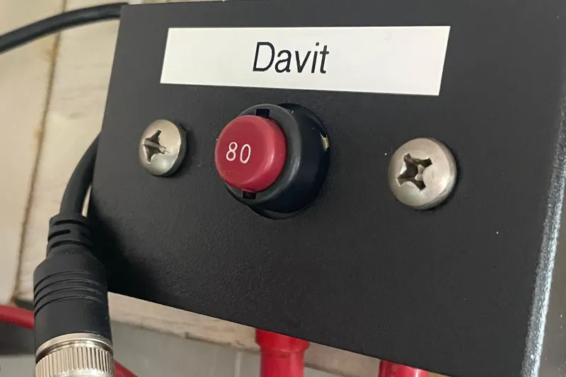  Yacht Photos Pics Control panel labeled "Davit" with red button on 1999 Bayliner 3988 Motoryacht.