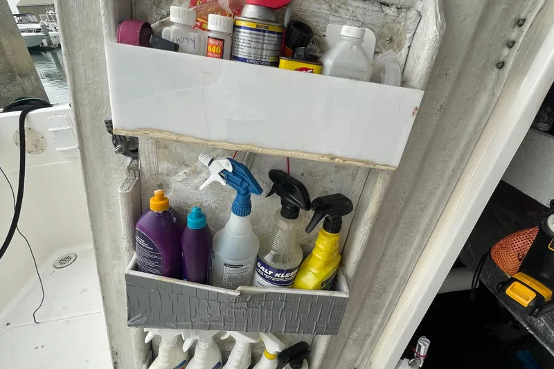  Yacht Photos Pics Storage shelf with cleaning supplies on a 1999 Bayliner 3988 Motoryacht.