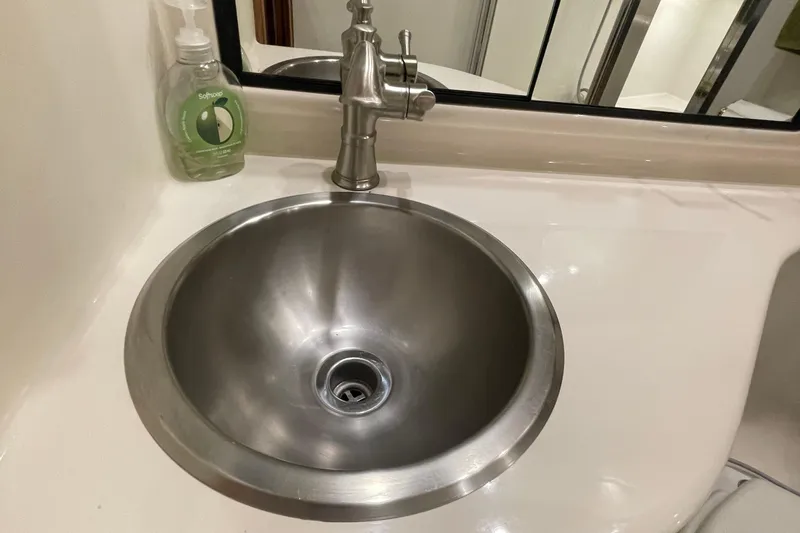 Yacht Photos Pics Stainless steel sink and faucet in 1999 Bayliner 3988 Motoryacht bathroom.
