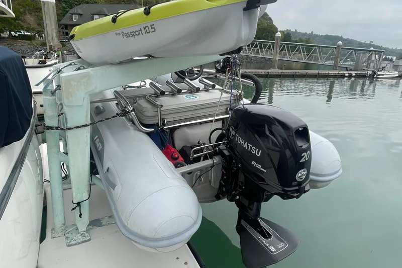  Yacht Photos Pics 1999 Bayliner 3988 Motoryacht with Tohatsu outboard motor and kayak, docked at marina.