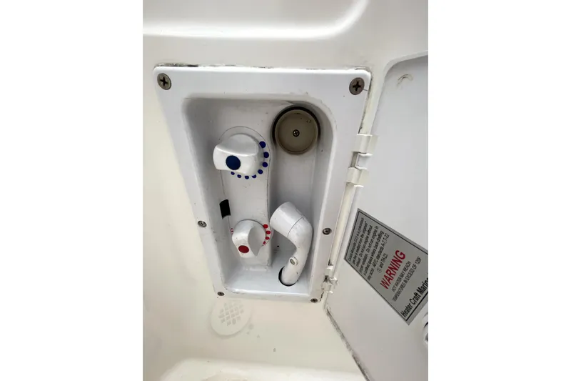  Yacht Photos Pics 1999 Bayliner 3988 Motoryacht shower controls with temperature indicators and warning label.