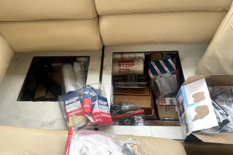  Yacht Photos Pics Storage compartments in a 1999 Bayliner 3988 Motoryacht filled with various boating supplies.