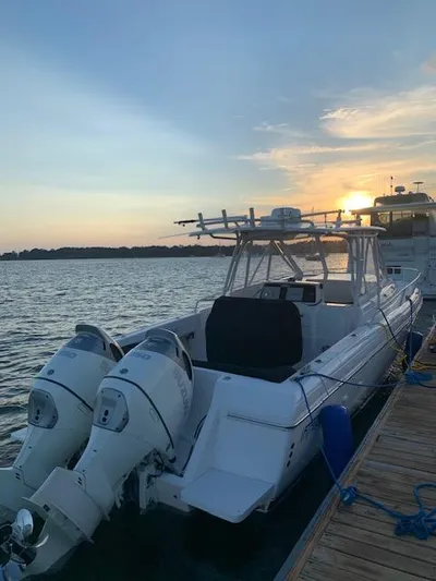Soggy Dollars Yacht Photos Pics 2007 Intrepid 35 Walkaround boat docked at sunset with dual outboard engines.