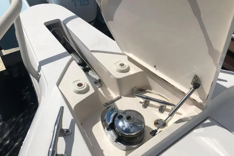 Soggy Dollars Yacht Photos Pics 2007 Intrepid 35 Walkaround boat deck with open hatch and winch system.