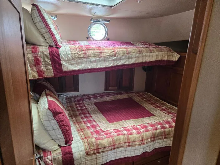 Chinook Yacht Photos Pics Bunk beds with plaid bedding in a 2010 American Tug 49 Limited cabin.