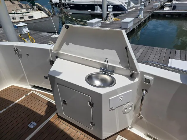 Chinook Yacht Photos Pics Outdoor sink on 2010 American Tug 49 Limited yacht, docked at marina.