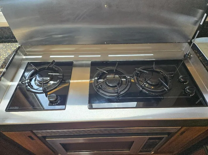 Chinook Yacht Photos Pics Stainless steel two-burner stove in 2010 American Tug 49 Limited yacht kitchen.