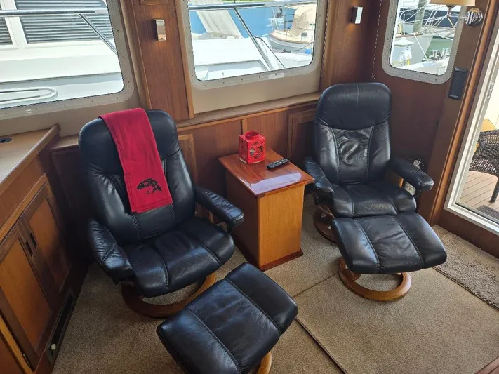 Chinook Yacht Photos Pics Luxurious 2010 American Tug 49 Limited interior with leather chairs and wooden accents.