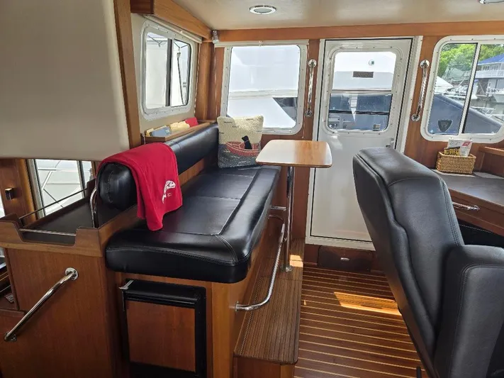 Chinook Yacht Photos Pics Interior of 2010 American Tug 49 Limited, featuring leather seating and wooden accents.