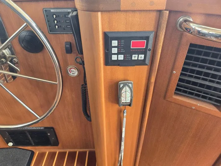 Chinook Yacht Photos Pics Control panel and steering wheel of a 2010 American Tug 49 Limited boat.