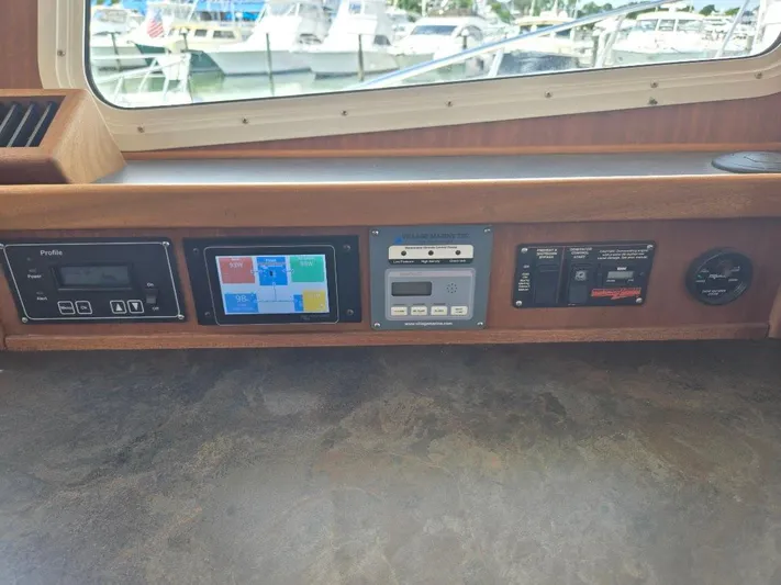 Chinook Yacht Photos Pics Control panel of a 2010 American Tug 49 Limited boat with various instruments.