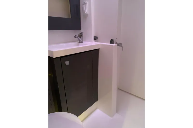 Freckled Parrot Yacht Photos Pics Bathroom sink area in 2015 Fountaine Pajot Helia 44 catamaran, featuring modern design.