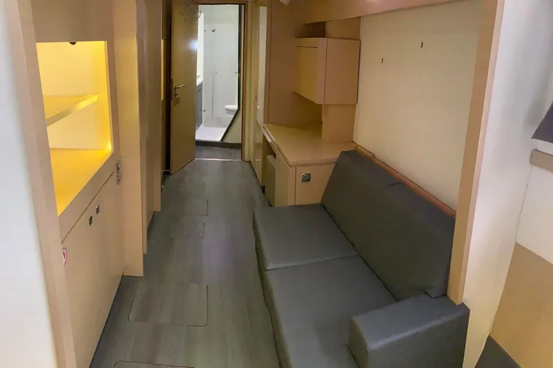 Freckled Parrot Yacht Photos Pics Interior of 2015 Fountaine Pajot Helia 44 catamaran, featuring modern seating and cabinetry.