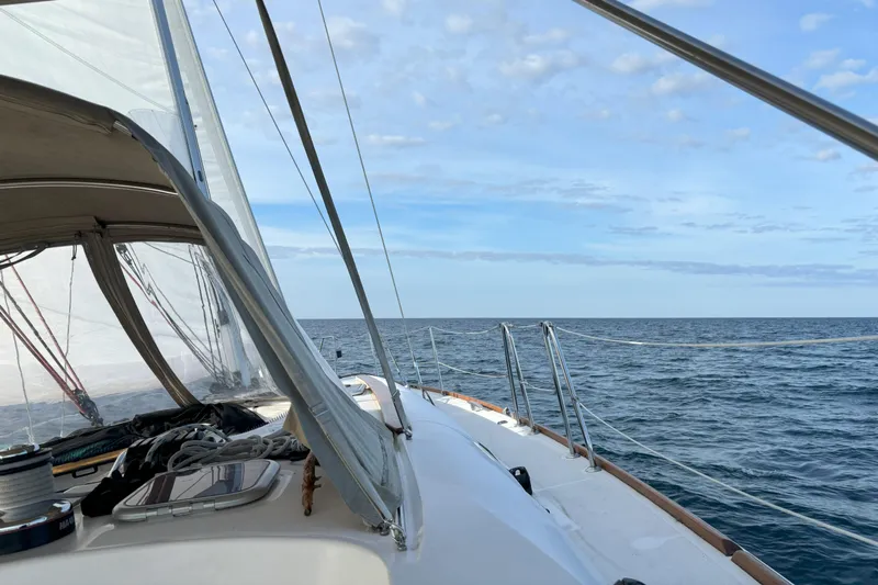  Yacht Photos Pics Sailing on a 2009 Jeanneau Sun Odyssey 44i yacht under clear skies.