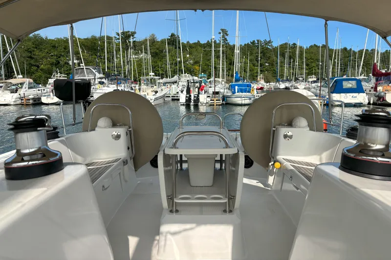  Yacht Photos Pics Cockpit view of 2009 Jeanneau Sun Odyssey 44i sailboat docked at a marina.