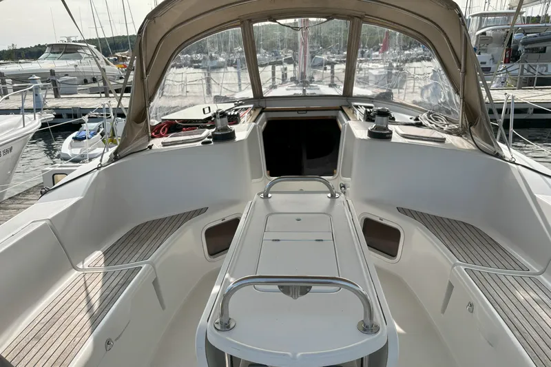  Yacht Photos Pics Cockpit of 2009 Jeanneau Sun Odyssey 44i sailboat, featuring spacious seating and helm.