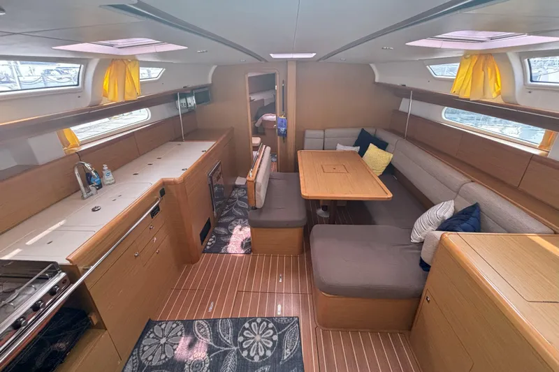  Yacht Photos Pics Spacious interior of 2009 Jeanneau Sun Odyssey 44i sailboat with modern furnishings.