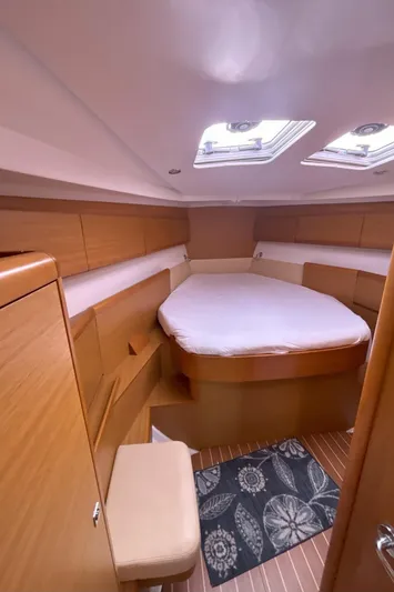  Yacht Photos Pics 2009 Jeanneau Sun Odyssey 44i cabin interior with skylights and wooden finish.