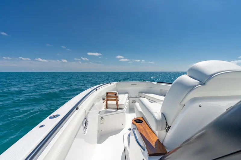 Papa Roach III Yacht Photos Pics 2025 Everglades 375 Center Console boat on open sea under clear blue sky.