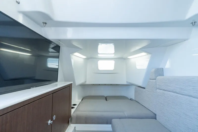 Papa Roach III Yacht Photos Pics 2025 Everglades 375 Center Console cabin interior with modern design and comfortable seating.