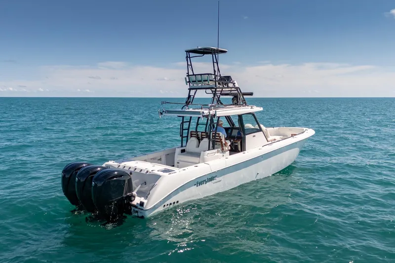 Papa Roach III Yacht Photos Pics 2025 Everglades 375 Center Console boat on open ocean, featuring triple outboard engines.
