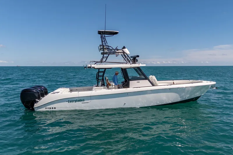 Papa Roach III Yacht Photos Pics 2025 Everglades 375 Center Console boat on open sea under clear blue sky.