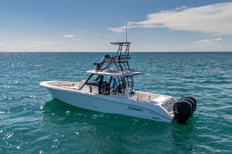 Papa Roach III Yacht Photos Pics 2025 Everglades 375 Center Console boat on open ocean under clear sky.