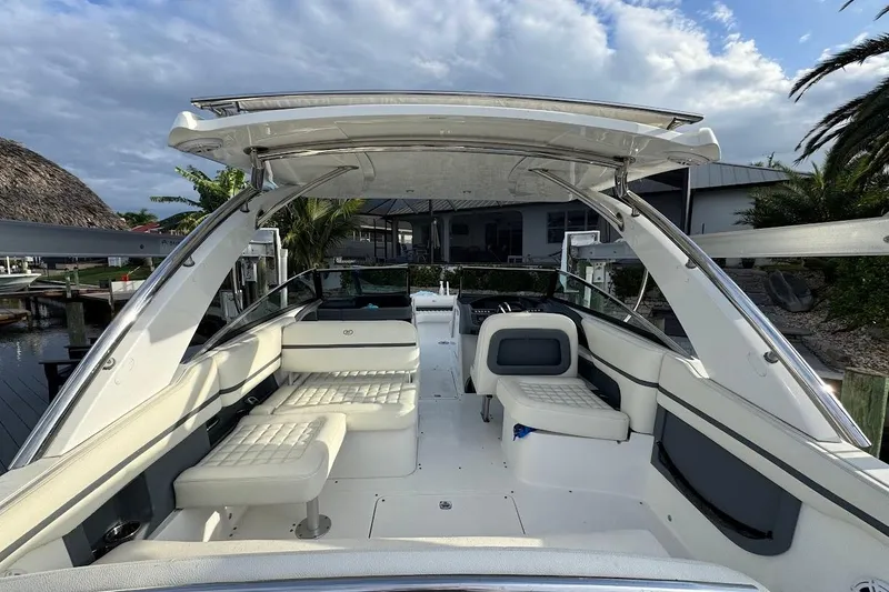  Yacht Photos Pics 2018 Cobalt 30SC boat interior with white seating, sleek design, and open canopy.