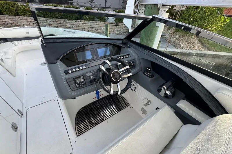  Yacht Photos Pics 2018 Cobalt 30SC boat helm with modern controls and sleek steering wheel.