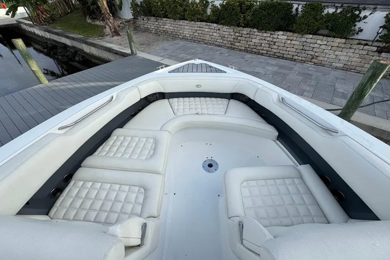  Yacht Photos Pics 2018 Cobalt 30SC boat with luxurious white seating and spacious deck area.