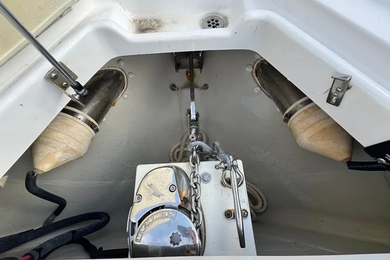  Yacht Photos Pics Anchor compartment of a 2018 Cobalt 30SC boat, featuring winch and chain.