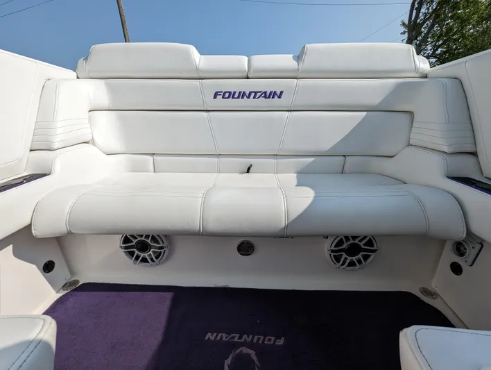  Yacht Photos Pics White leather seating on a 2006 Fountain 42 boat with integrated speakers.