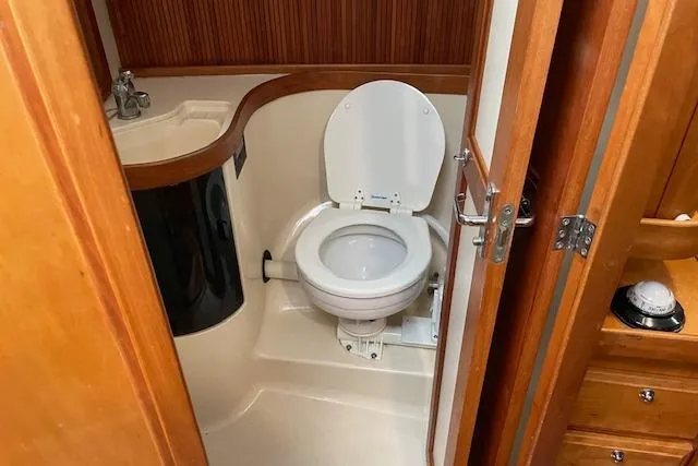 Souwester Yacht Photos Pics Bathroom interior of 2003 Sabre 362 yacht, featuring a compact toilet and sink.