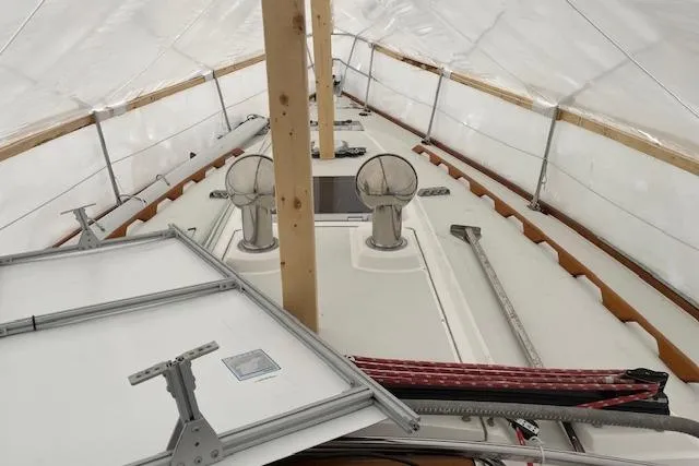 Souwester Yacht Photos Pics 2003 Sabre 362 sailboat under protective cover, showcasing deck and equipment.