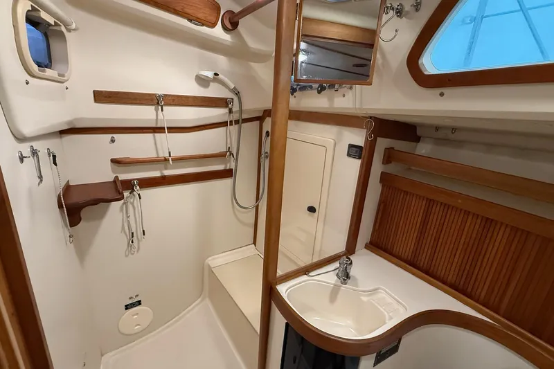 Souwester Yacht Photos Pics 2003 Sabre 362 yacht bathroom with wooden accents and compact sink.