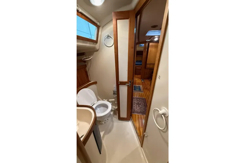Souwester Yacht Photos Pics Bathroom interior of 2003 Sabre 362 yacht with wooden accents and modern fixtures.