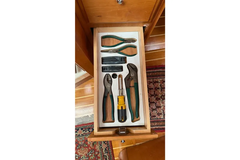 Souwester Yacht Photos Pics Drawer with assorted tools on a 2003 Sabre 362 boat, including pliers and screwdriver.