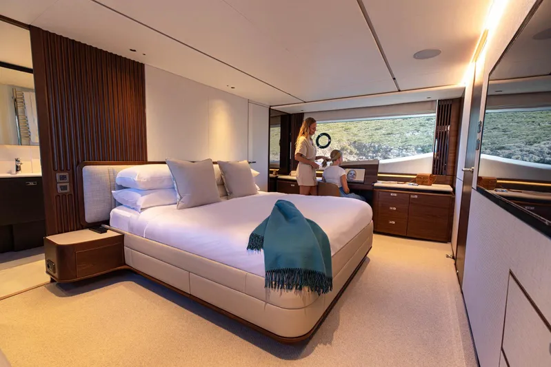  Yacht Photos Pics Luxurious bedroom interior of 2024 Princess Y80 yacht with scenic window view.