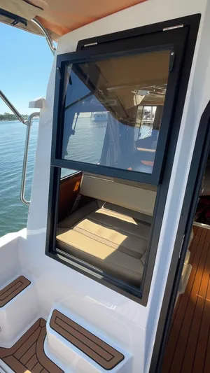  Yacht Photos Pics 2022 Ranger Tugs R-25 boat with window view and seating area.