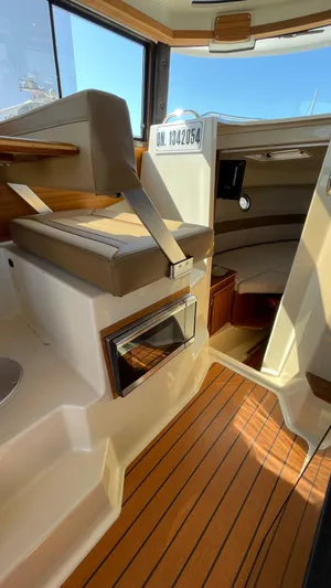  Yacht Photos Pics 2022 Ranger Tugs R-25 interior with wood flooring and seating area.