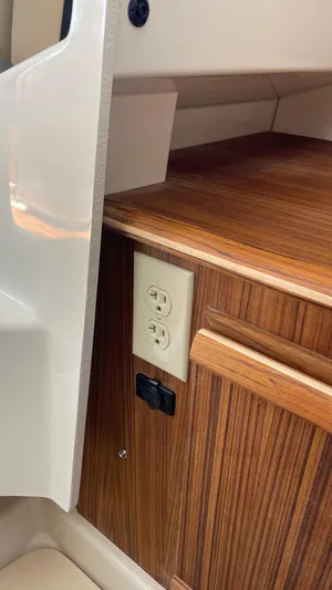 Yacht Photos Pics 2022 Ranger Tugs R-25 interior with wood finish and electrical outlet.